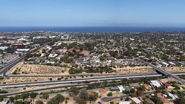 Christie Downs, South Adelaide, South Australia: 4K aerial drone footage of residential suburb, houses, estates, streets, highways, traffic and urban infrastructure