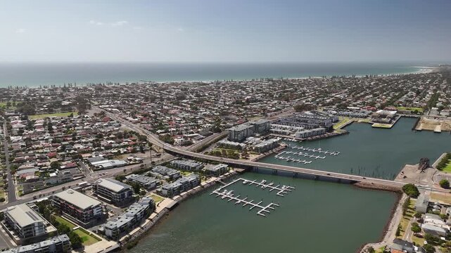 Port Adelaide, South Australia: 4K aerial drone footage of harbour, Port River, marina, coastal suburbs and historic waterfront cityscape, presidential houses, estates in Semaphore, Birkenhead. 