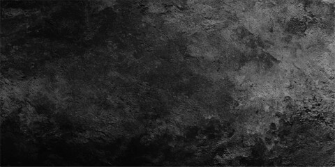 Fototapeta premium A dark and aged grunge wall texture featuring a rough gray concrete surface with a dirty vintage pattern for a black textured wallpaper backdrop