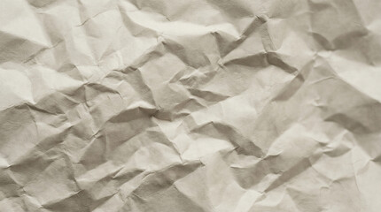 Fototapeta premium Crumpled beige paper creating textured background pattern