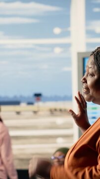 Vertical Video Emotional airport farewell with parents saying goodbye to teen daughter, child leaving to study abroad at university. Young traveler with luggage and passport prepares to airplane alone
