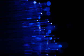 Blue fibers glow softly against deep black © FATIR29