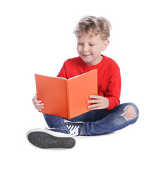 Naklejka premium Cute little boy reading book on white background