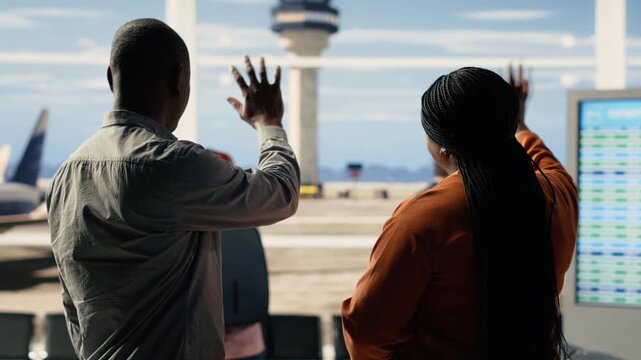 Relieved comic parents waving goodbye to daughter and sharing high-five, celebrating empty nest milestone with upbeat lighthearted expressions. Job done concept and freedom in airport.