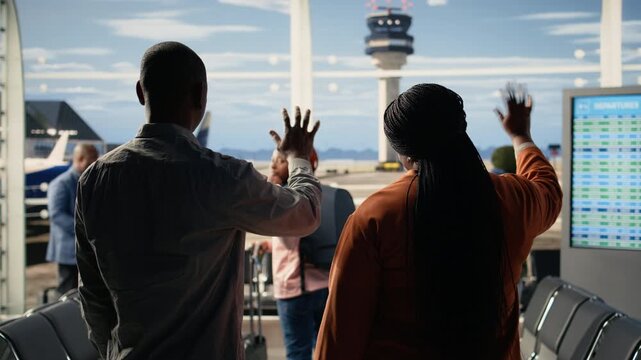 Waving goodbye at airport, sad mother and father, daughter studying abroad, traveling alone and boarding at terminal gate. Supportive parents bid farewell to solo traveler girl student.