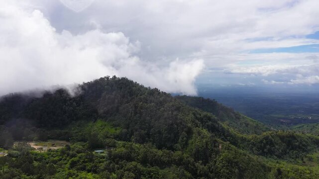 Aerial view of the mountain range is covered with evergreen rainforest. Philippines, Mindanao.
