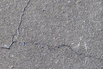 Obraz premium Cracked Concrete Surface Texture with Diagonal Fracture Line Background