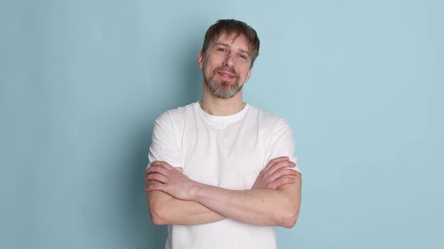 Handsome man posing on light blue background