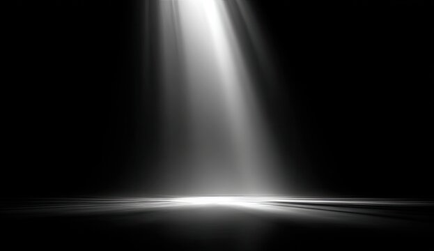 Bright beam of light illuminates dark space, creating dramatic effect