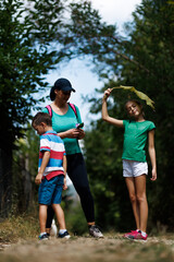 Naklejka premium Family enjoys a summer day outdoors exploring nature and spending quality time together
