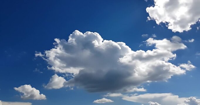 Single Object: Fluffy White Cumulus Cloud in a Bright Blue Sky