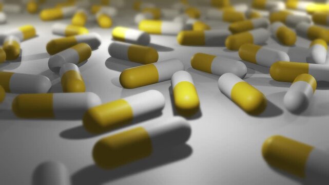Camera Pans Across Cinematic Yellow and White Pill or Drug Capsules