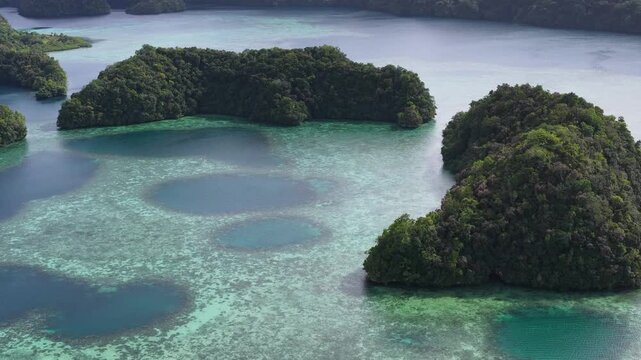 Aerial View of Lush Limestone Islands and Coral Reefs in Palau