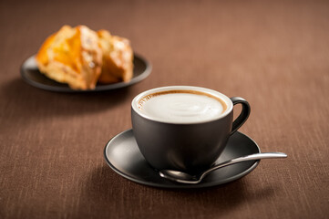 Fototapeta premium Homemade Caffe Latte with Rich Milk Foam and Freshly Baked Scones