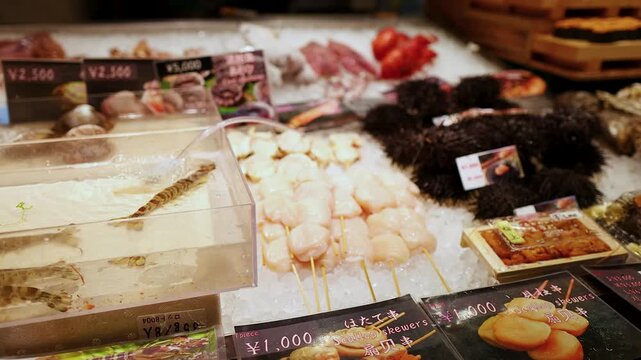 Fresh Seafood Display with Live Prawns and Sea Urchins in Osaka