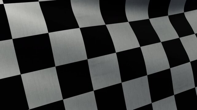 Close-up of a black and white checkered flag fluttering in the wind