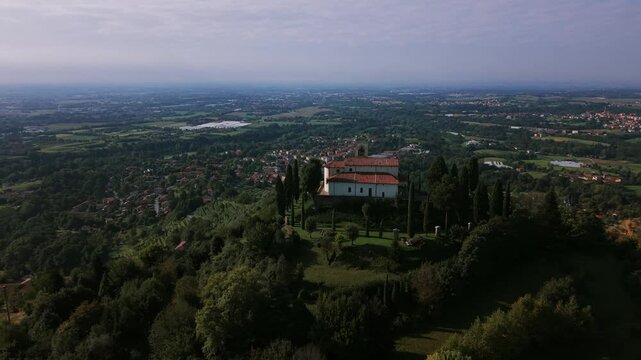 Drone view of the sanctuary of Montevecchia on a hilltop overlooking the plains of Brianza in Lombardy, Italy. Aerial, copy space
