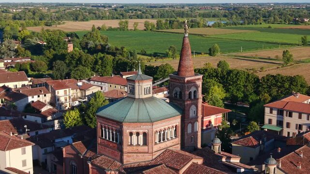 Drone orbiting around church of Santa Maria delle Grazie with its large octagonal dome in Soncino, Italy. Aerial view