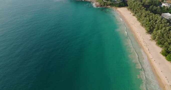 Aerial View Of Nai Thon Beach In Phuket, Thailand, With Luxury Resort In Lush Forested Headland Revealed. tilt-up shot