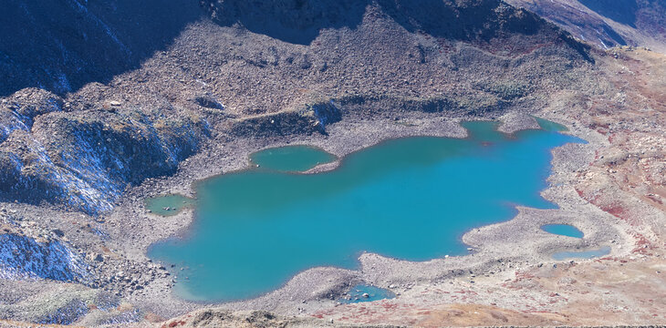 Beautiful top view of Alpather lake of Apharwat peak in Gulmarg, Jammu and Kashmir, India. showing sparkling blue water. Trekking, One day trek, Kashmir tourism concept.