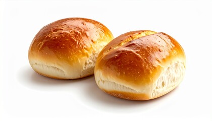 Fototapeta premium Two golden brown dinner rolls on a white background.