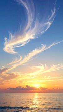 Serene sunset over calm ocean with wispy clouds
