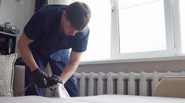 Professional Cleaning And Fixing Services. Technician Assesses And Restores Fabric Damage Seamlessly. Expert Cleaner Evaluates And Repairs Upholstery To Maintain Quality Appearance