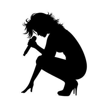 Silhouette of a female singer performing with a microphone.