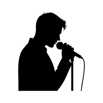 Silhouette of a man singing into a microphone on stage.