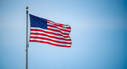 Fototapeta premium American flag waving high on memorial day to honor fallen heroes and commemorate military service