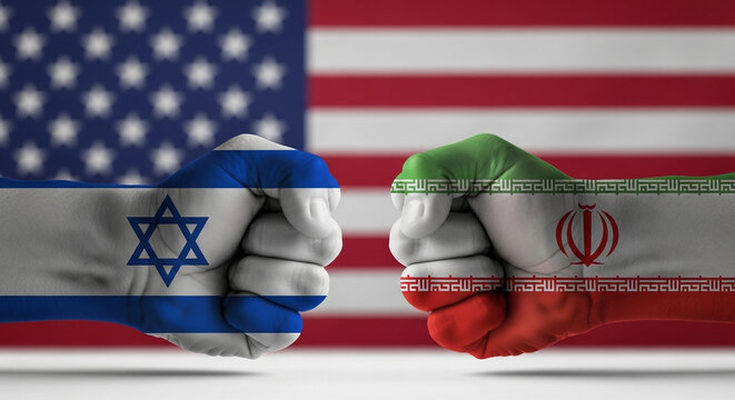 Fists painted with Israeli and Iranian flags confront each other, symbolizing geopolitical tension with the US flag in the background.