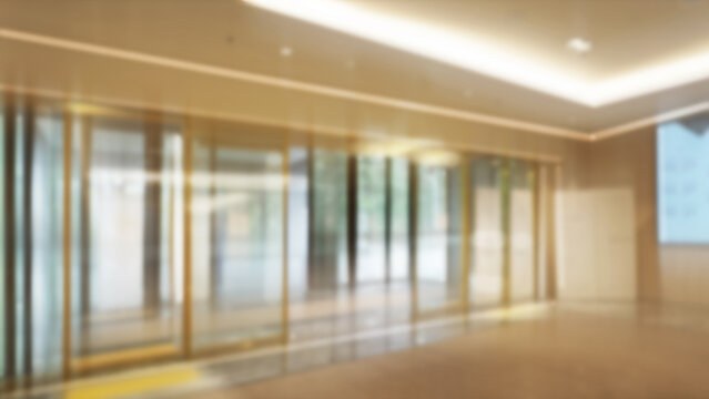 Bright and Glamorous Entrance of Large Building with Automatic Doors and Blurred Lights