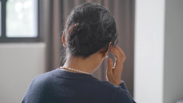 Elderly woman sitting in bed while thinking something, get dizzy, migraine headache, pain stress, anxiety, brain fog, depression retirement, feeling vertigo, anxious disoriented, losing consciousness