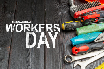 Fototapeta premium Celebration of International Workers Day on May 1 with tools and equipment on a table