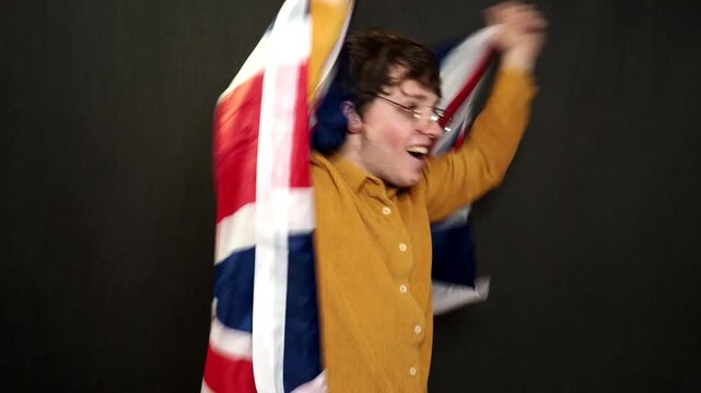 A football fan rejoices at his team's victory and shouts hurray.