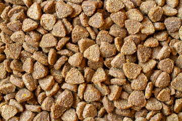 Brown dry pet food. Pelleted cat food. © Сергей Васильченко