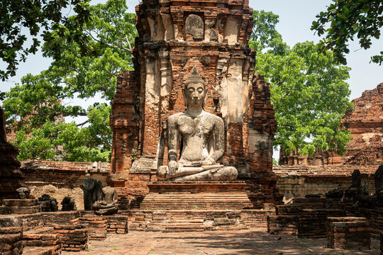 Buddha statue in Wat Mahathat temple, Thailand. Ayutthaya is the ancient ruined capital of kingdom Siam.
