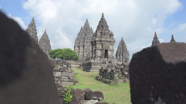 A 4K cinematic of Prambanan Temple during sunny weather, located in Yogyakarta. The largest Hindu temple complex in Indonesia, built in the 9th century AD by the Sanjaya Dynasty.