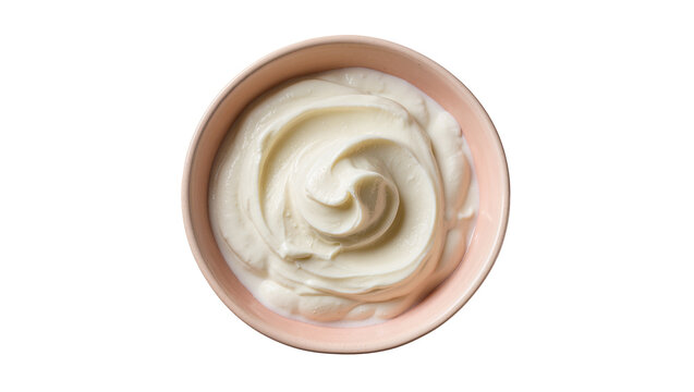 Overhead view of a delicious creamy white yogurt or sour cream swirl in a pink bowl