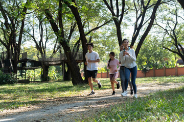 Fototapeta premium Group of Asian people jogging at public park