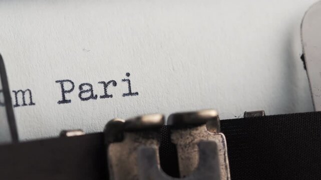 Writing from Paris with love with a typewriter, capturing thoughts and feelings in a quiet moment at home