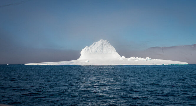 ceberg floating in the Arctic Ocean near Greenland, likely near Ilulissat. 
