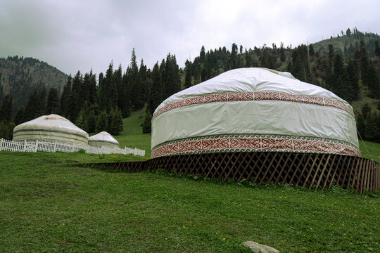 Kazakh traditional yurt in mountains. Outdoor camping in traditional yourt concept. Travel in Kazakhstan.