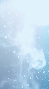 Soft abstract background with floating light particles and gentle motion. Light blue. Vertical.
