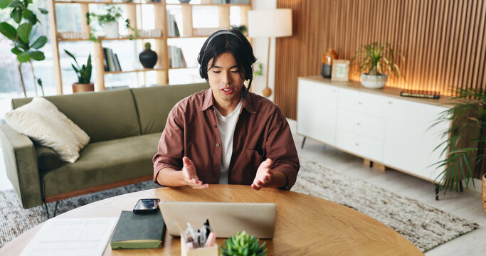 Man, consultant or remote work with headset for video call, customer service or online advice. Male person, asian agent or freelancer talking on computer for virtual chat, webinar or meeting in home