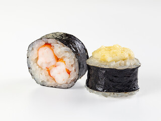 Two maki sushi rolls, one with shrimp filling and one baked with a cheese cap, isolated on a white background. © Andrei Starostin
