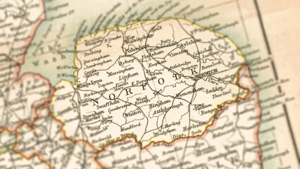 Fototapeta premium Macro View of Vintage Map Highlighting Norfolk Shire England with Detailed Regional Cartography