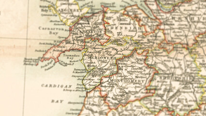 Fototapeta premium Macro View of Vintage Map Highlighting Merionethshire Wales with Detailed Regional Cartography