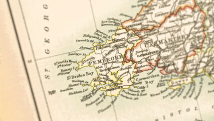 Fototapeta premium Macro View of Vintage Map Highlighting Pembrokeshire Wales with Detailed Regional Cartography