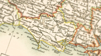 Obraz premium Macro View of Vintage Map Highlighting Dorset Shire England with Detailed Regional Cartography
